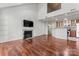 Open concept living room and kitchen with hardwood floors at 513 N Graham St # 3D, Charlotte, NC 28202