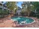 Community pool with brick patio and surrounding apartments at 513 N Graham St # 3D, Charlotte, NC 28202