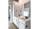 Double vanity bathroom with white cabinets and quartz countertops at 723 E Memorial Hwy, Harmony, NC 28634