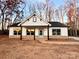 Two story house featuring a stylish front porch and stone accents at 723 E Memorial Hwy, Harmony, NC 28634