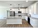 Modern kitchen featuring white cabinets, granite countertops, and stainless steel appliances at 723 E Memorial Hwy, Harmony, NC 28634