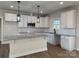 Modern kitchen featuring white cabinets, granite countertops, and stainless steel appliances at 723 E Memorial Hwy, Harmony, NC 28634