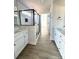 Main bathroom with white cabinets, a walk-in shower, and modern fixtures at 737 E Memorial Hwy, Harmony, NC 28634