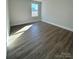 Spacious bedroom with hardwood floors and a window at 737 E Memorial Hwy, Harmony, NC 28634