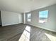 Bright bedroom with hardwood floors and large windows at 737 E Memorial Hwy, Harmony, NC 28634