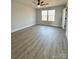 Spacious bedroom with hardwood floors and large windows at 737 E Memorial Hwy, Harmony, NC 28634