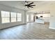 Spacious living room with wood-look floors and an open floor plan at 737 E Memorial Hwy, Harmony, NC 28634