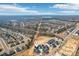 Expansive aerial view of a neighborhood featuring new construction homes and sprawling greenery at 809 Terra Dr, Tega Cay, SC 29708