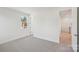 Carpeted bedroom with view from window and hallway entrance at 809 Terra Dr, Tega Cay, SC 29708