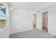 A carpeted bedroom with a bright window view and an open closet space at 809 Terra Dr, Tega Cay, SC 29708