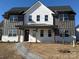 Charming new construction home featuring a brick walkway, light and dark siding, and a covered front porch at 809 Terra Dr, Tega Cay, SC 29708