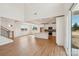 Bright, open-concept living area with a kitchen featuring white cabinets and stainless steel appliances at 809 Terra Dr, Tega Cay, SC 29708