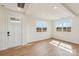 Bright living room with hardwood floors, recessed lighting, and large windows offering scenic views at 809 Terra Dr, Tega Cay, SC 29708