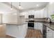 Modern kitchen with white cabinets, stainless steel appliances and gray countertops at 1436 Panther Rd, Lancaster, SC 29720