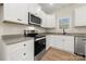 Bright kitchen with stainless steel appliances, white cabinets, and a view to the outside at 1436 Panther Rd, Lancaster, SC 29720