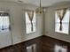 Bright dining room features wood floors, neutral paint, and updated lighting fixtures at 1610 Ledson Ct, Charlotte, NC 28214