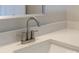 Close-up of a bathroom sink with modern faucet and light countertop, providing a clean and stylish look at 2014 Crown Point Dr # 2008-B, Albemarle, NC 28001