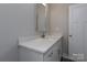 Modern bathroom vanity with a large mirror, clean lines, and ample storage, creating a functional and stylish space at 2014 Crown Point Dr # 2008-B, Albemarle, NC 28001