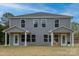 Charming two-story duplex featuring a symmetrical design, gray siding, and covered entrances perfect for modern living at 2014 Crown Point Dr # 2008-B, Albemarle, NC 28001
