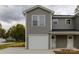 Two-story new construction townhome with gray siding, white trim and a two-car garage at 2014 Crown Point Dr # 2008-B, Albemarle, NC 28001