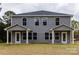 New construction gray townhome with covered entrances and well manicured landscaping at 2014 Crown Point Dr # 2008-B, Albemarle, NC 28001