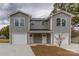 New gray townhome offers a front-entry two-car garage and covered front porch at 2014 Crown Point Dr # 2008-B, Albemarle, NC 28001