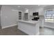 Bright kitchen features white cabinets, stainless appliances, and quartz countertops at 2014 Crown Point Dr # 2008-B, Albemarle, NC 28001