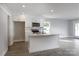 Modern kitchen features white cabinets, stainless steel appliances, and center island at 2014 Crown Point Dr # 2008-B, Albemarle, NC 28001