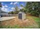 Large backyard with storage shed and open green space at 6934 Spring Morning Ln, Charlotte, NC 28227