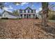 Two story house with a covered porch and charming landscaping at 6934 Spring Morning Ln, Charlotte, NC 28227