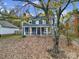 Two story blue house with covered porch and landscaping at 6934 Spring Morning Ln, Charlotte, NC 28227