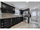Modern kitchen with granite countertops and stainless steel appliances at 6934 Spring Morning Ln, Charlotte, NC 28227