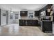 Eat-in kitchen with dark wood cabinets and tile flooring at 6934 Spring Morning Ln, Charlotte, NC 28227