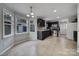 Kitchen with dark cabinets, stainless steel appliances, and tiled floor at 6934 Spring Morning Ln, Charlotte, NC 28227