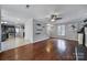 Open living room and kitchen with hardwood floors at 6934 Spring Morning Ln, Charlotte, NC 28227