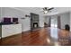Living room with fireplace, hardwood floors, and backyard access at 6934 Spring Morning Ln, Charlotte, NC 28227