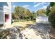 Large backyard with a detached garage and a lush lawn, perfect for outdoor activities and entertaining at 70 Spring Nw St, Concord, NC 28025