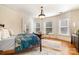 Bright bedroom features hardwood floors, lots of natural light and a ceiling light fixture at 70 Spring Nw St, Concord, NC 28025
