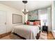 This stylish bedroom has a unique wallpaper and a chandelier at 70 Spring Nw St, Concord, NC 28025