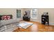 This bedroom has hardwood floors and two large windows at 70 Spring Nw St, Concord, NC 28025