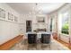 Bright dining room featuring modern lighting, wainscoting, and elegant furniture at 70 Spring Nw St, Concord, NC 28025