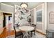 Dining room featuring hardwood floors, flower wallpaper and natural light at 70 Spring Nw St, Concord, NC 28025