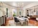 Bright dining room featuring modern lighting, wainscoting, and elegant furniture at 70 Spring Nw St, Concord, NC 28025