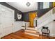 Grand entryway with hardwood floors, beautiful stairs, and decorative lighting fixture at 70 Spring Nw St, Concord, NC 28025