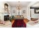 Inviting living room with a cozy fireplace, large windows, and elegant furnishings at 70 Spring Nw St, Concord, NC 28025