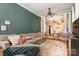 Spacious living room leads into the dining area with hardwood floors and a ceiling fan at 70 Spring Nw St, Concord, NC 28025