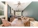 Open living room filled with lots of natural light, a ceiling fan, and hardwood floors at 70 Spring Nw St, Concord, NC 28025