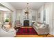 Inviting living room with a cozy fireplace, large windows, and elegant furnishings at 70 Spring Nw St, Concord, NC 28025