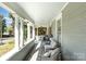 A spacious front porch offers an inviting outdoor living space at 70 Spring Nw St, Concord, NC 28025