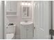 Simple bathroom with single sink vanity, toilet and medicine cabinet at 12017 Baywoods Dr, Tega Cay, SC 29708